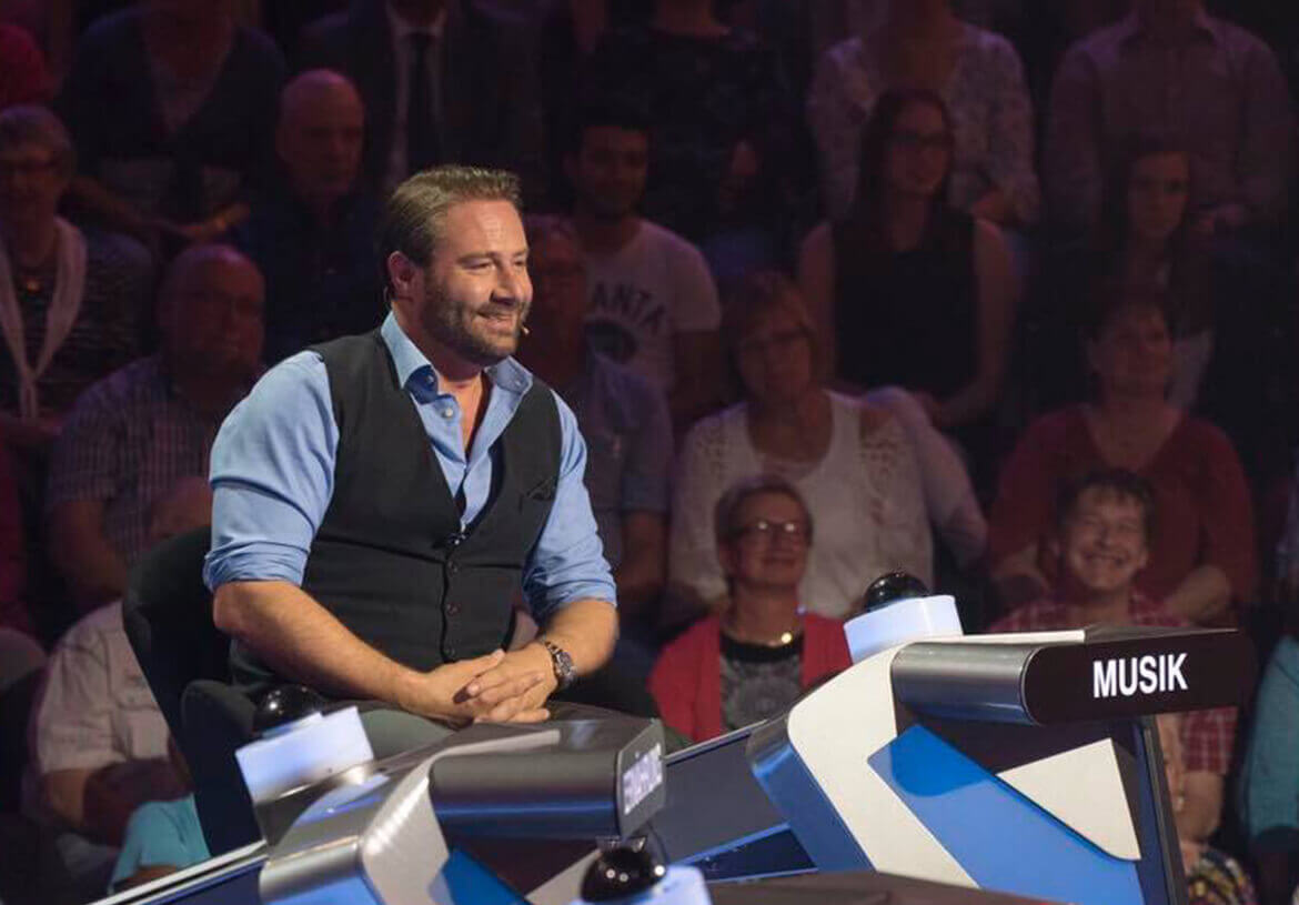Singer and TV guest judge Sasha in a men’s vest by DORNSCHILD.