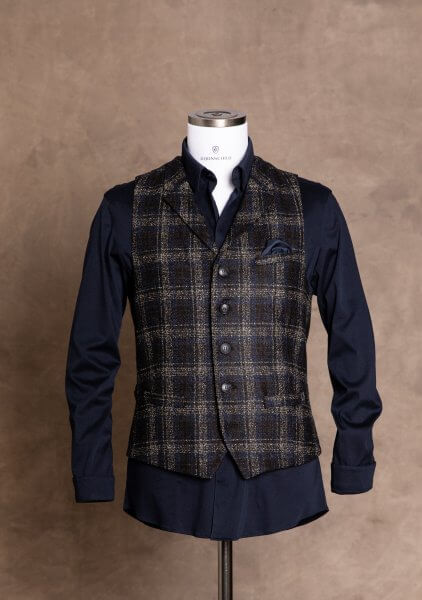 Elegant and stylish premium men's vest gilet from DORNSCHILD black blue plaid with fine stripes in cognac made of feisty Italian fabric.